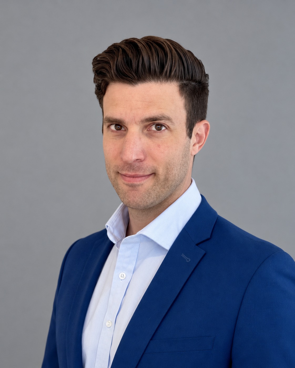 Steve Samuel, Co-Founder and CEO of Kinemetry, photographed against a neutral grey background.